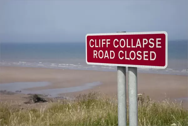 Danger Collapsing Cliffs Sign - on coast Skipsea East Riding of Yorskhire UK
