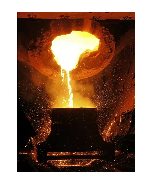 Molten metal being poured from a vat