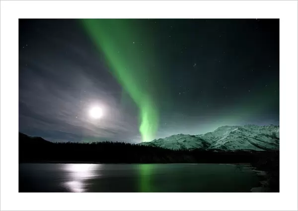 Aurora borealis and Moon