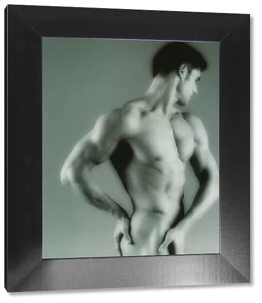 Nude man. MODEL RELEASED. Nude man seen from the side