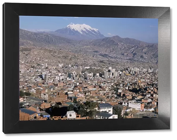 View across city from El Alto, with Illimani volcano in distance, La Paz