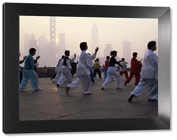 People doing early morning t ai chi exercises in the Huangpu Park on the Bund