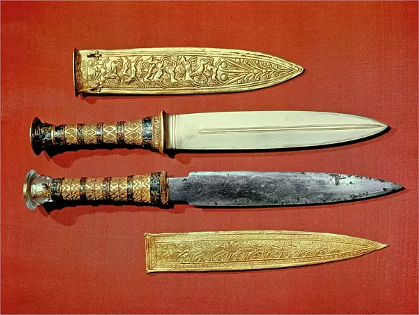 The kings two daggers, one with a blade of gold, the other of iron