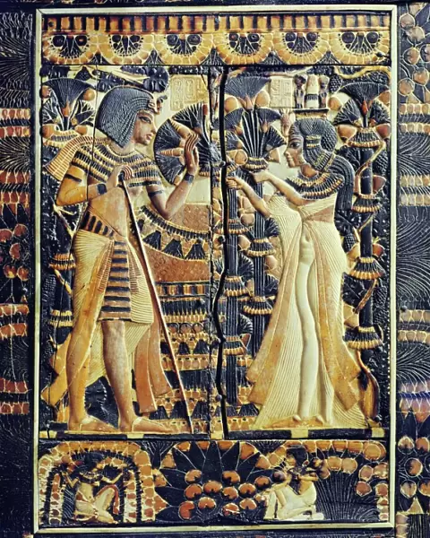 Painted ivory plaque from the lid of a coffer showing Tutankhamun and Ankhesenamun in a garden