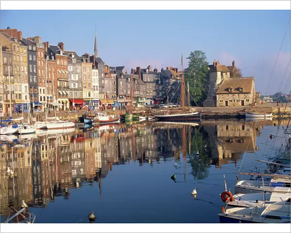 Reflections of houses and boats in the old harbour at Honfleur, Basse Normandie