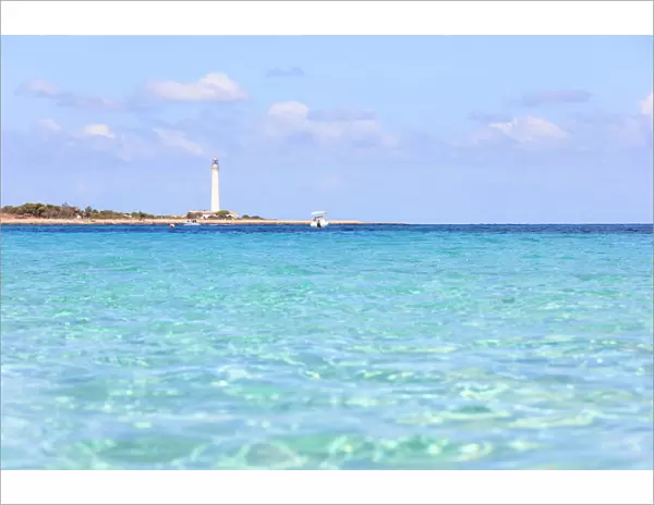 Turquoise sea with lighthouse in the background, San Vito Lo Capo, province of Trapani