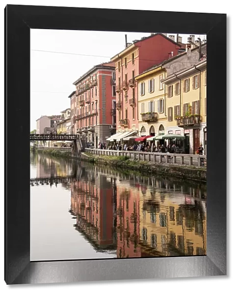 Old buildings reflected in the Naviglio Grande, Milan, Lombardy, Italy, Europe