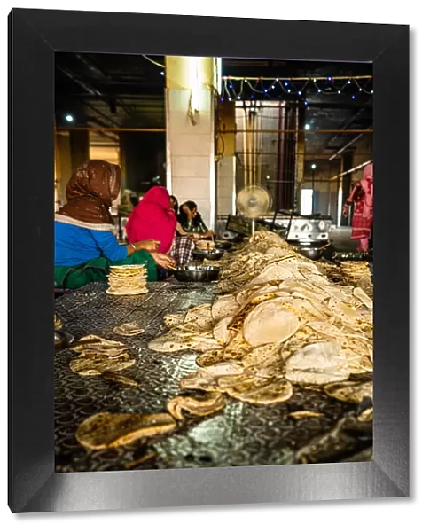A pile of fresh roti being sorted at the Golden Temple, Amritsar, Punjab, India, Asia