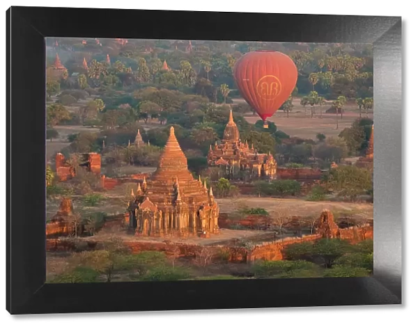 Old temple in Bagan and hot-air balloons before sunrise, Old Bagan (Pagan), UNESCO World Heritage Site, Myanmar (Burma), Asia