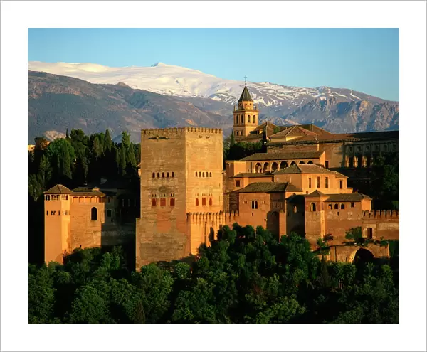 The Alhambra Palace, UNESCO World Heritage Site, with the snow covered Sierra Nevada mountains in the background, Granada, Andalucia