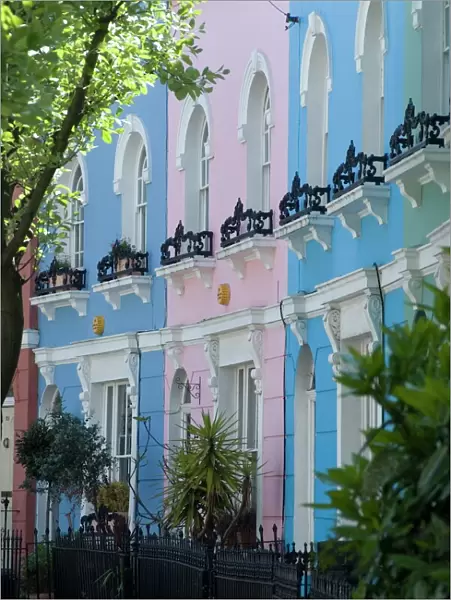Pastel painted terraced houses, Kelly Street, Kentish Town, London, England