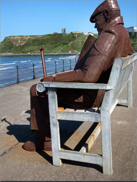 Ray Lonsdale sculpture of a Man on a Bench in North Bay, Scarborough, North Yorkshire, Yorkshire, England, United Kingdom, Europe