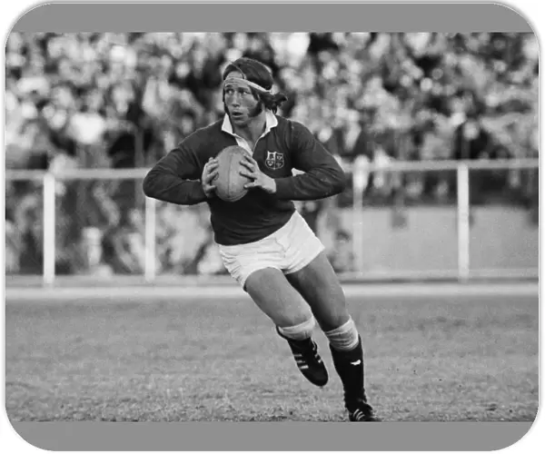 JPR Williams runs with the ball for the British Lions