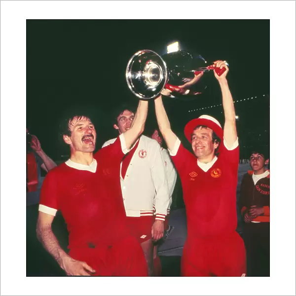 Liverpools Phil Neal and Ian Callaghan celebrate victory in the 1977 European Cup Final