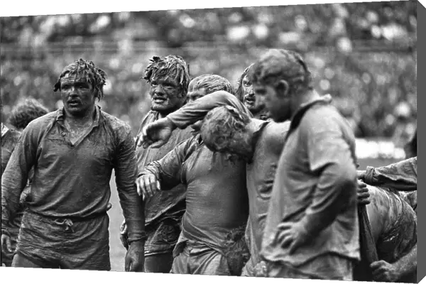 Mud-covered British Lions forwards face the Junior All Blacks in 1977