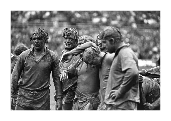 Mud-covered British Lions forwards face the Junior All Blacks in 1977