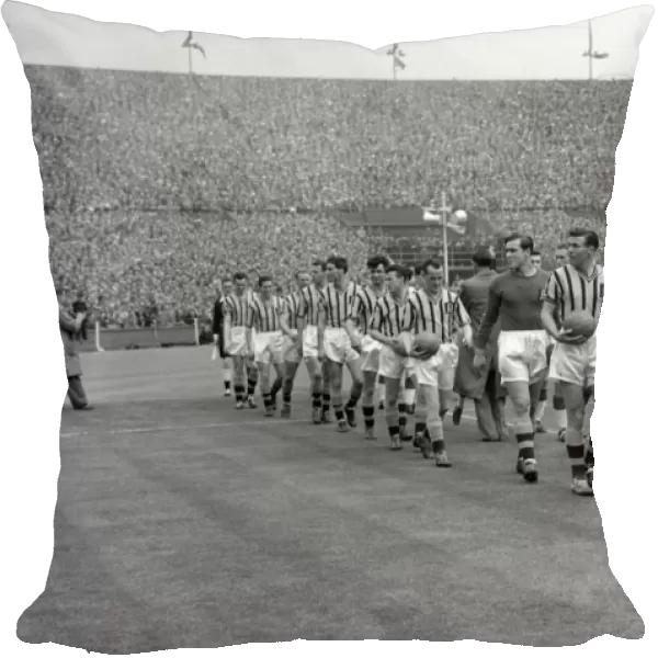 United manager Matt Busby and Villa manager Eric Houghton lead their sides out for the 1957 FA Cup Final