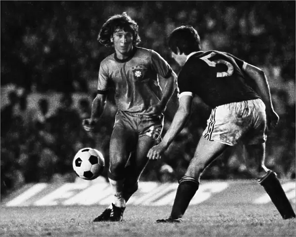 Brazils Zico runs at Scotlands Tom Forsyth in 1977