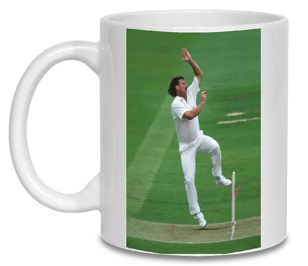 Ian Botham bowls for England in 1992