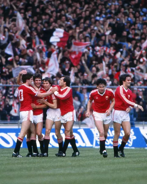 Bryan Robson celebrates the first goal of the game with his Manchester United teammates - 1983 FA Cup Final replay