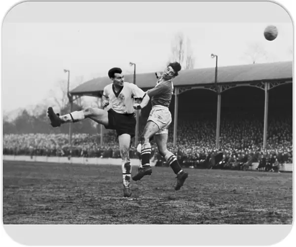 Darlingtons Ken Furphy and Chelseas Ron Tindall jump for a header during the 1958 FA Cup