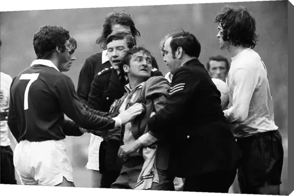 A Scottish fan is removed from the Wembley pitch after attacking Alan Ball - 1973 British Home Championship