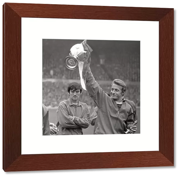 George Best and Denis Law, with the league championship trophy, in 1967
