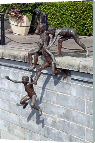 People of the River statue by Chong Fah Cheong of children jumping into the river in Singapore, Republic of Singapore
