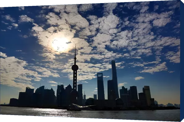 General view of the Pudong city skyline in Shanghai in silhouette with the Oriental Pearl TV Tower, Shanghai, China