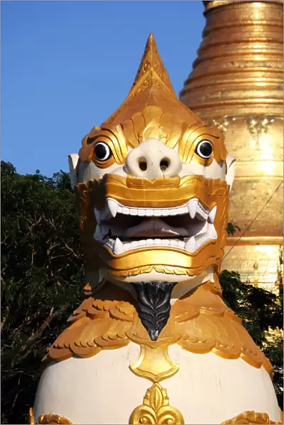 Giant lion statue at the entrance of the Shwedagon Pagoda, Yangon, Myanmar