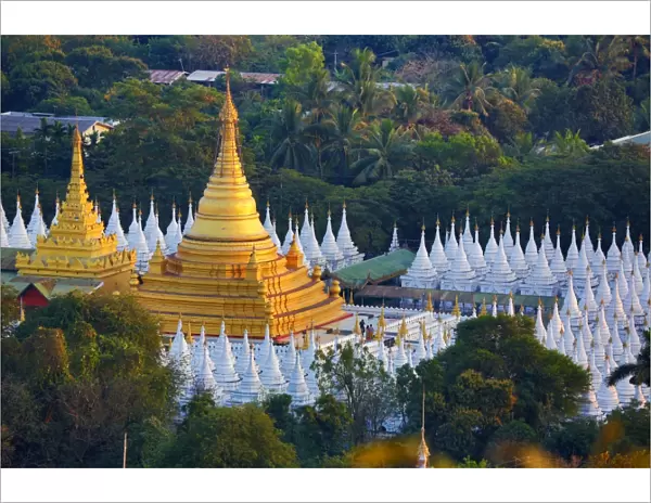Gold stupa and white dhamma ceti shrines of Sandamuni Pagoda, Mandalay, Myanmar (Burma)