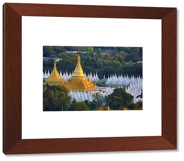 Gold stupa and white dhamma ceti shrines of Sandamuni Pagoda, Mandalay, Myanmar (Burma)