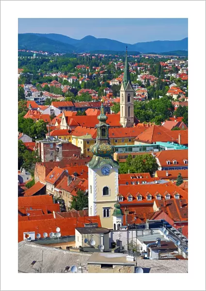 Aerial view of rooftops and the towers of St Marys Church and St Francis Church in Zagreb