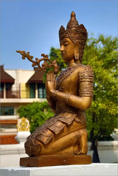 Statue at the City Pillar Shrine at Wat Chedi Luang Temple in Chiang Mai, Thailand