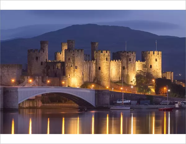 Conwy Castle illuminated at night, Conwy, Wales. Spring (May) 2017