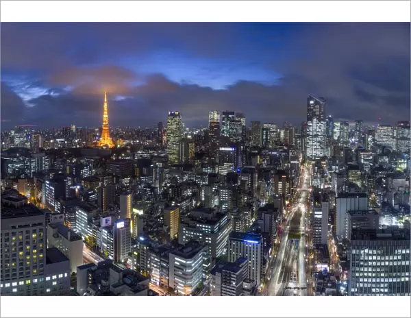 Japan, Tokyo, elevated night view of the city skyline and iconic illuminated Tokyo Tower