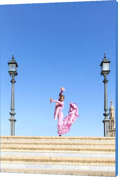 Spain, Andalusia, Seville. Flamenco dancer performing in Plaza de Espana