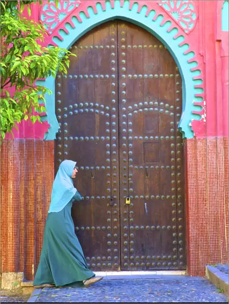 Person Walikng Infront Of Traditional Moroccan Decorative Door, Tangier, Morocco