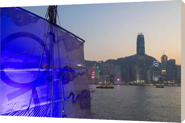 Junk boat in Victoria Harbour at dusk, Hong Kong Island, Hong Kong