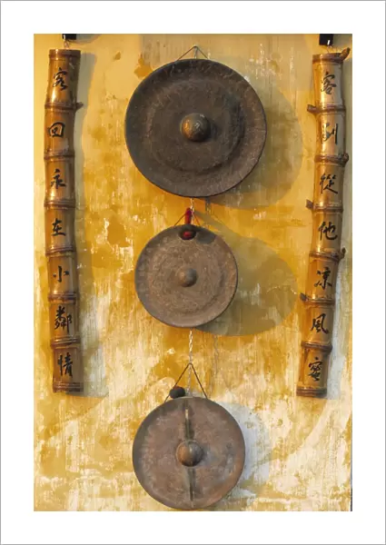 Gongs hanging on a wall