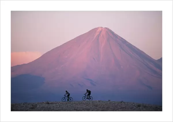 Mountain biking in the Atacama Desert against a backdrop