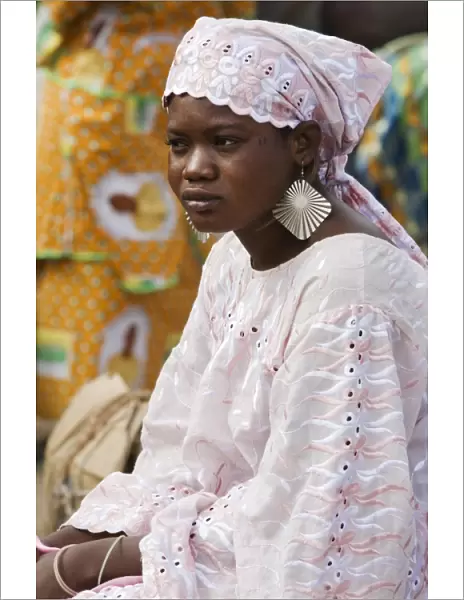 Mali, DjennA Peul woman wearing large earrings at Djennarket