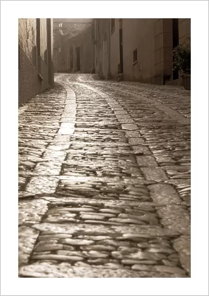 Europe, Italy, Sicily. A foggy morning in the streets of Erice
