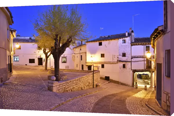 The old houses dating back to the 15 th century at the Plaza Mayor of Chinchon at dusk