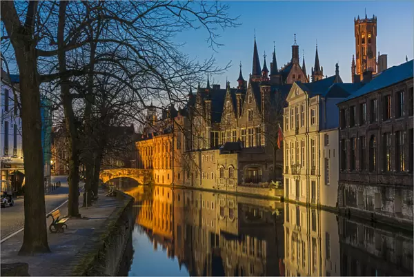 Picturesque blue hour view over Dijver canal with Belfort tower in the background