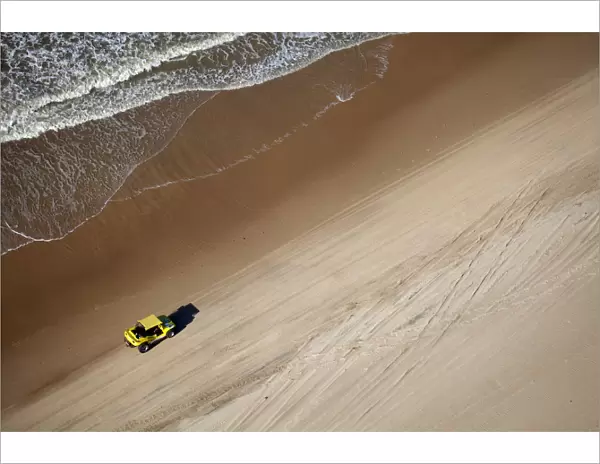 South America, Brazil, Ceara, Fortaleza, Aerial view of a yellow beach buggy driving