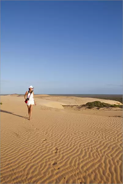 South America, Brazil, Ceara, Morro Branco, a photographer looks out over the dry