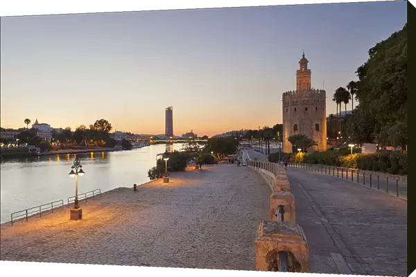 Torre del Oro (Tower of Gold) and river Guadalquivir at dusk, Seville, province of