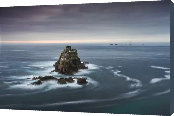 The Armed Knight rock stack and Longships Lighthouse off the coast at Lands End