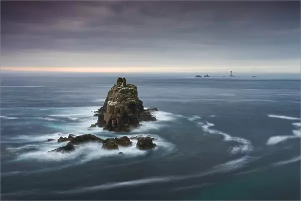 The Armed Knight rock stack and Longships Lighthouse off the coast at Lands End